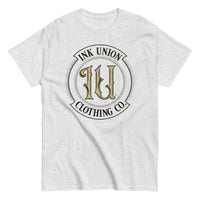 An ash grey t-shirt with the Ink Union Clothing Co Badge logo in black and gold centered on the front of the shirt.
