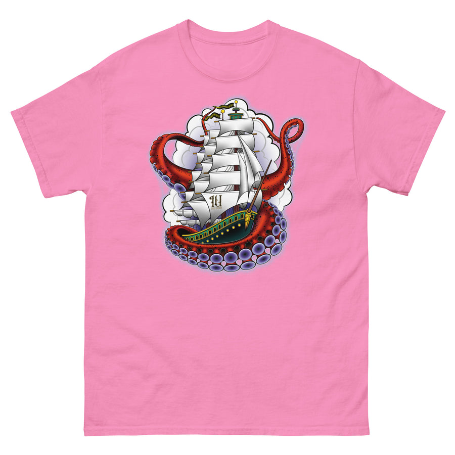 A pink t-shirt with an old-school clipper ship tattoo design in green and brown with white sails surrounded by octopus tentacles in shades of red with purple tentacles. Behind the ship are purple-tinged clouds.