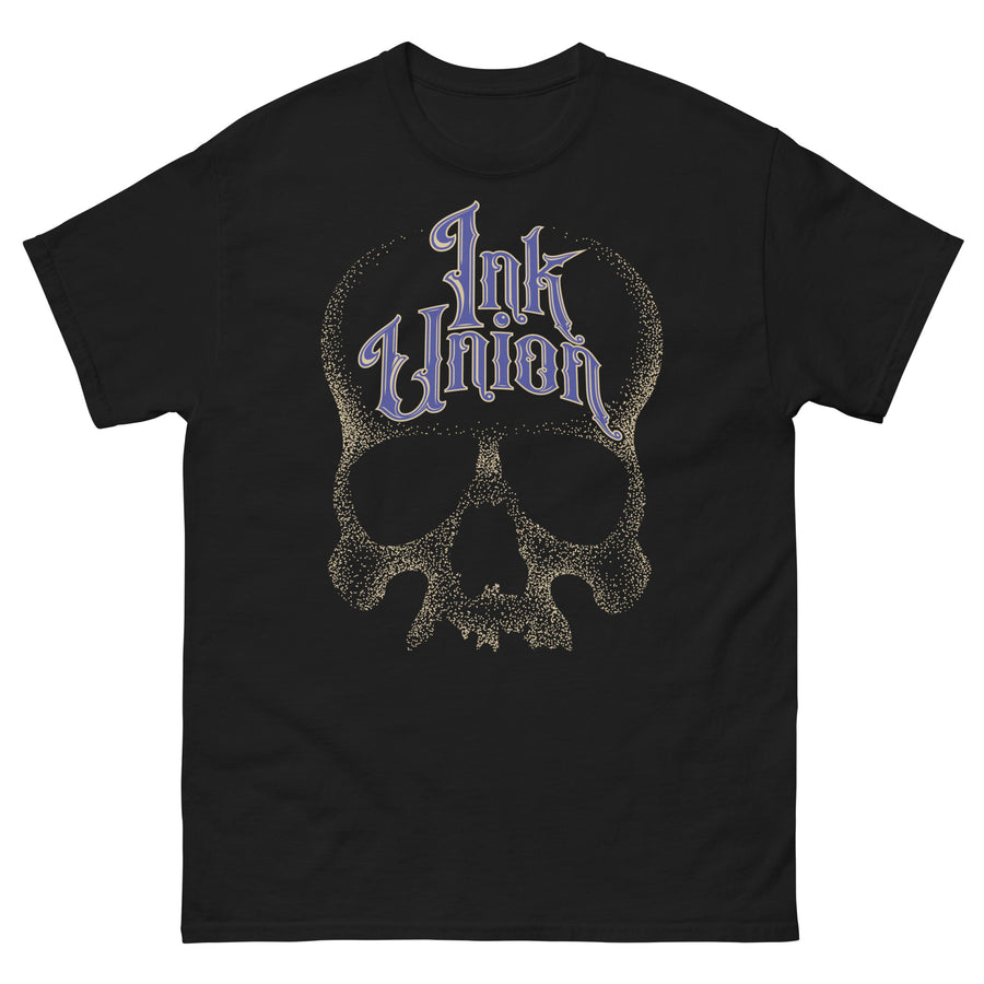 A black t-shirt  adorned with a gold dot work human skull and the words Ink Union in fancy gold and blue lettering across the forehead of the skull.