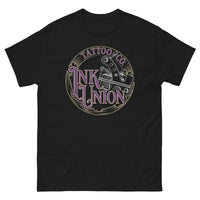 A black t-shirt adorned with the Ink Union Tattoo Co. purple and gold with a silver tattoo machine logo.