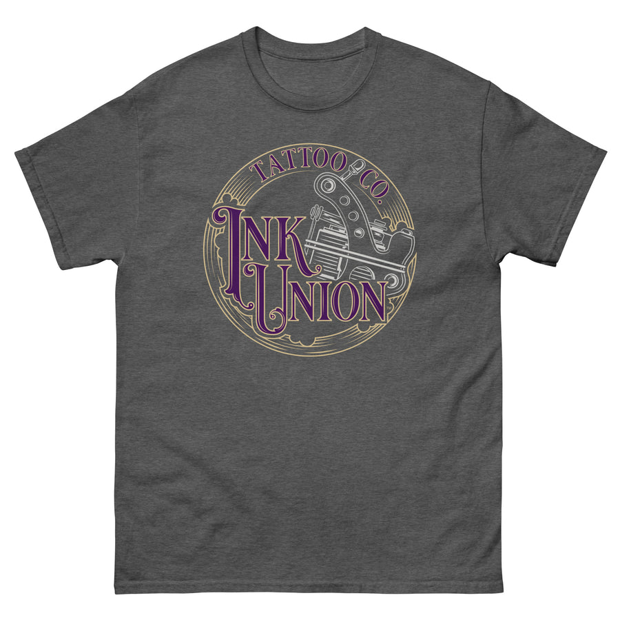 A dark grey t-shirt adorned with the Ink Union Tattoo Co. purple and gold with a silver tattoo machine logo.