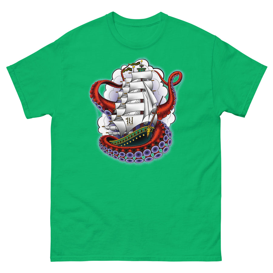 A medium green t-shirt with an old-school clipper ship tattoo design in green and brown with white sails surrounded by octopus tentacles in shades of red with purple tentacles. Behind the ship are purple-tinged clouds.