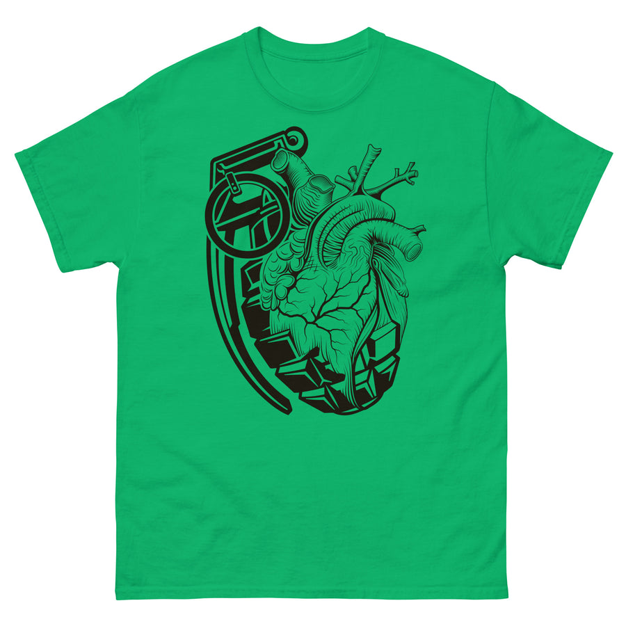 A green t-shirt with a black grenade of sold color and line work morphing into an anatomical heart drawn using line work and hatching for shading at the top right of the image.