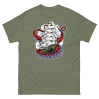 An olive green t-shirt with an old-school clipper ship tattoo design in green and brown with white sails surrounded by octopus tentacles in shades of red with purple tentacles. Behind the ship are purple-tinged clouds.