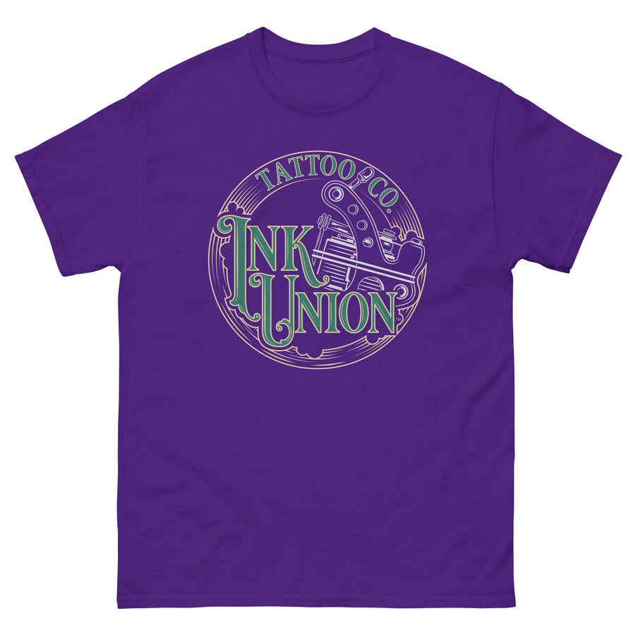 A purple t-shirt adorned with the Ink Union Tattoo Co. green and gold with a silver tattoo machine logo.