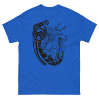 A royal blue t-shirt with a black grenade of sold color and line work morphing into an anatomical heart drawn using line work and hatching for shading at the top right of the image.