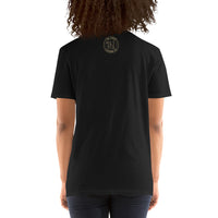 The rear view of an attractive woman wearing a black t-shirt with a small gold Ink Union Clothing Co. loThe rear view of an attractive woman wearing a black t-shirt with a small gold Ink Union Clothing Co. logo positioned just below the collar.go positioned just below the collar.