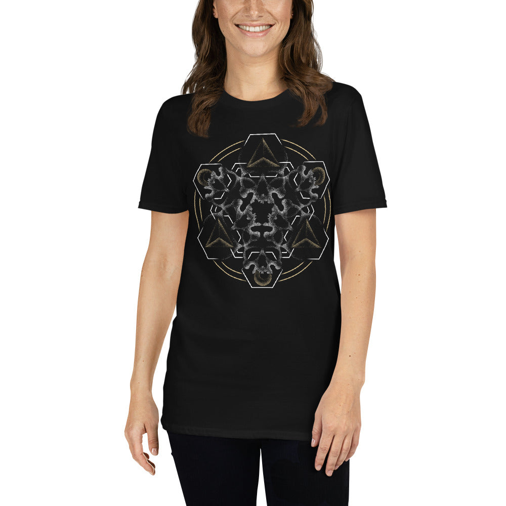 A woman wearing a black t-shirt with a mandala built from white dot work skulls and gold and white geometric shapes.