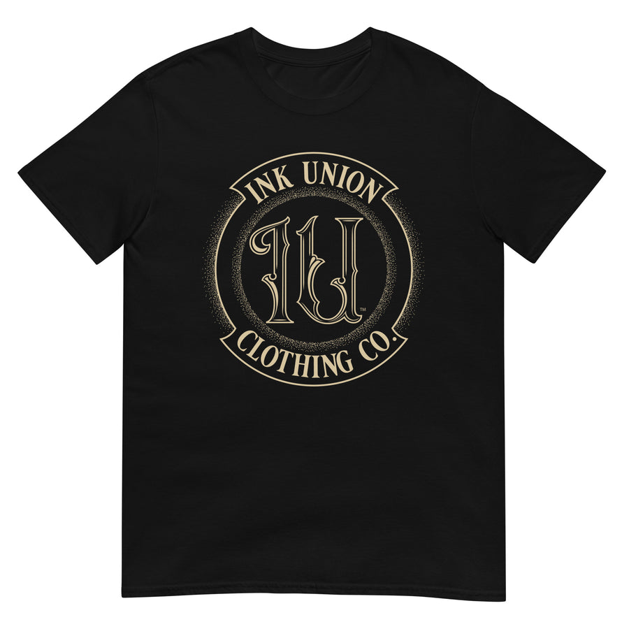 A black t-shirt adorned with the Ink Union Clothing Co gold badge logo containing fancy lettering and dot work gradients.