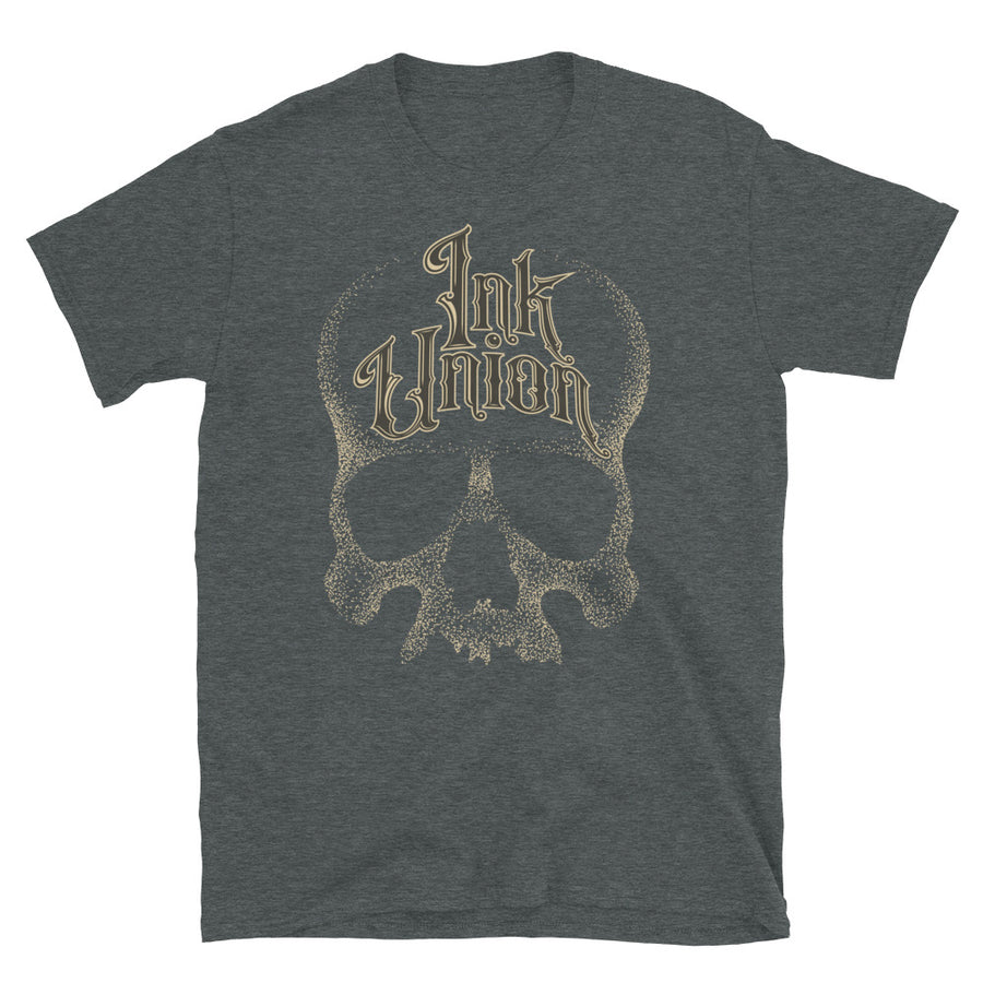 A dark grey t-shirt adorned with a gold dot work human skull  and the words Ink Union in fancy gold and black lettering across the forehead of the skull.