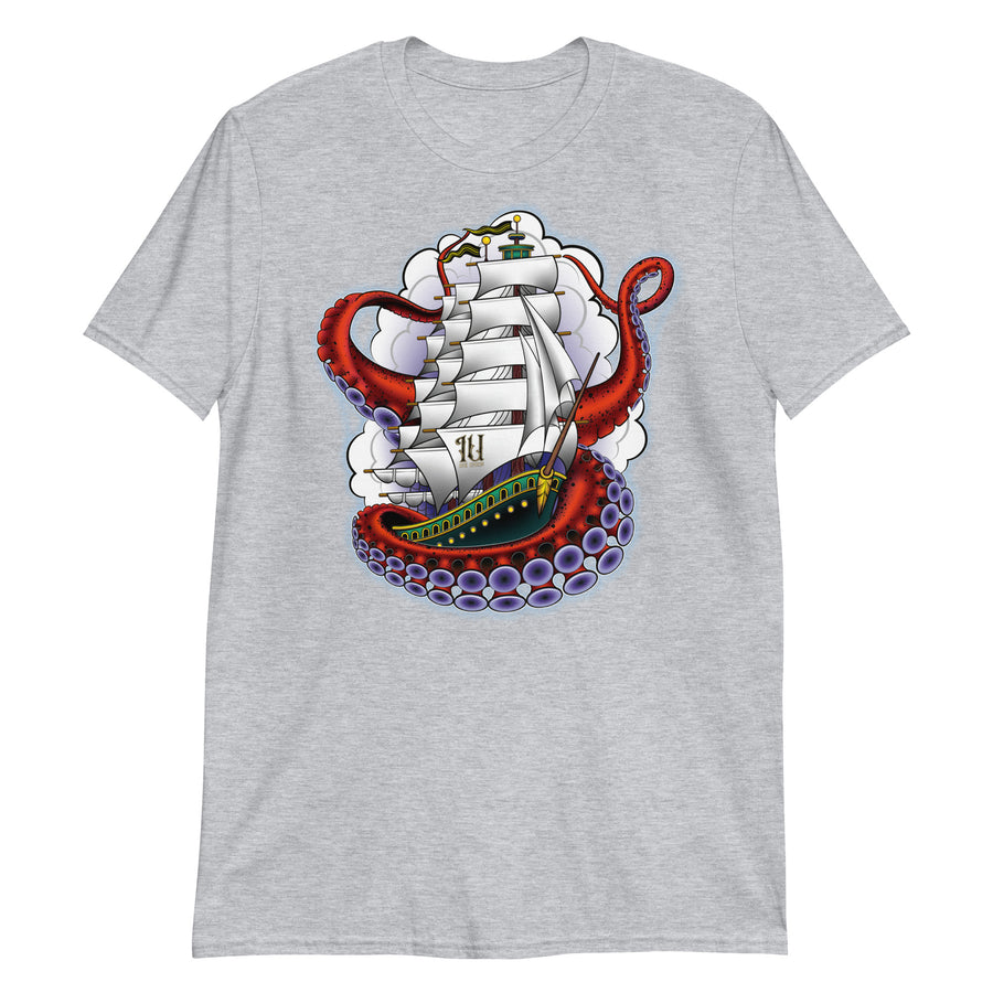 A light grey t-shirt with an old-school clipper ship tattoo design in green and brown with white sails surrounded by octopus tentacles in shades of red with purple tentacles. Behind the ship are purple-tinged clouds.