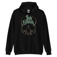 A black hoodie adorned with a gold dot work human skull and the words Ink Union in fancy gold and green lettering across the forehead of the skull.