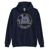 A navy blue hoodie with a gold circle containing fancy lettering in blue and gold that says Ink Union and a gold tattoo machine peeking out from behind on the right side.  There is a dot work gradient inside the circle, and the words Tattoo Co. in gold are at the bottom of the design.
