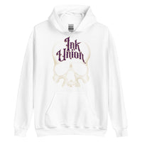 A white hoodie adorned with a gold dot work human skull and the words Ink Union in fancy gold and purple lettering across the forehead of the skull.