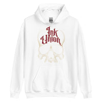 A white hoodie adorned with a gold dot work human skull and the words Ink Union in fancy gold and red lettering across the forehead of the skull.