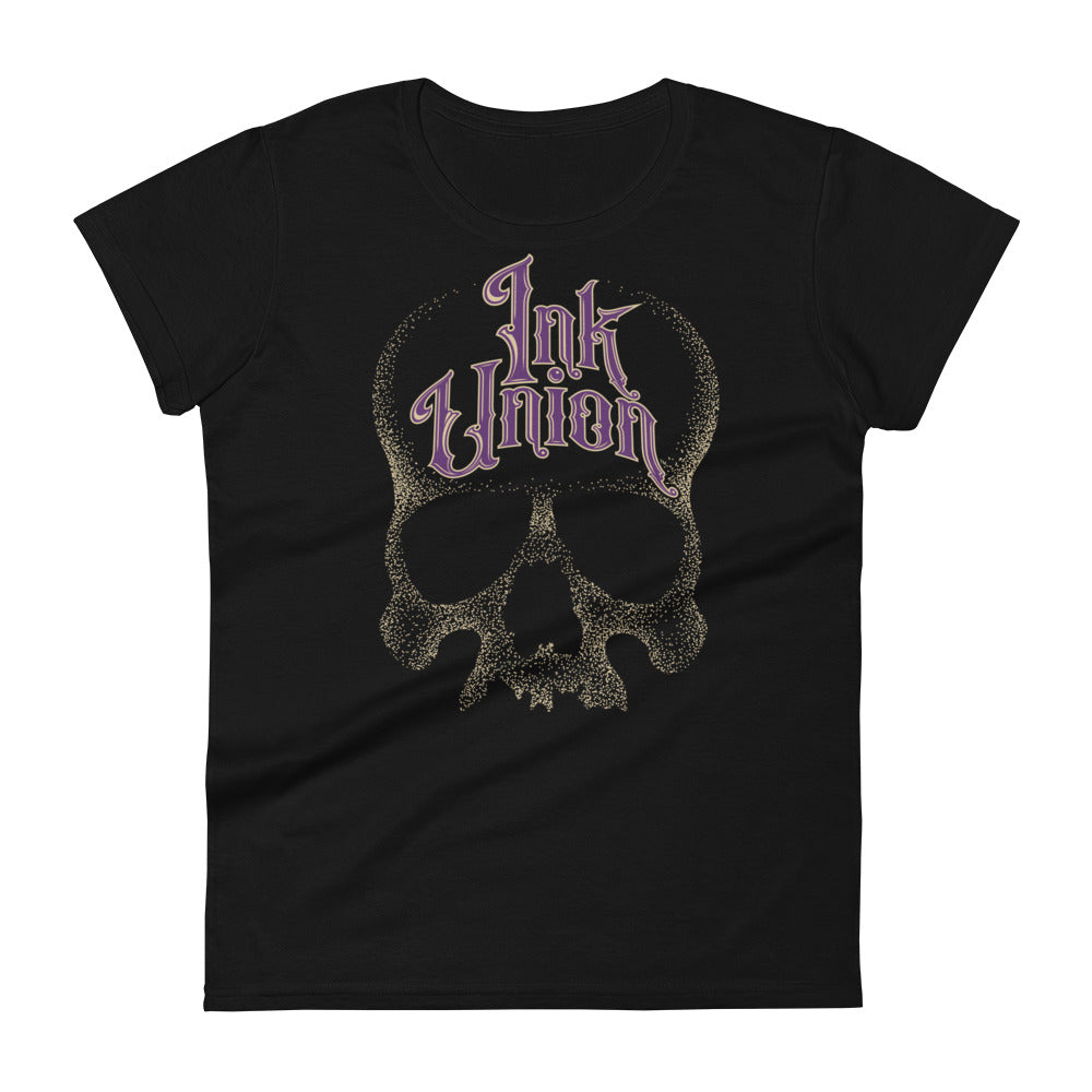 A black t-shirt with a gold dot work human skull and the words Ink Union in fancy gold and purple lettering across the forehead of the skull.