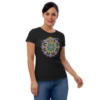 A woman wearing a black t-shirt with a mandala containing pink lotus flowers and honeycomb designs and a life-like honeybee flying toward you at the top of the mandala.