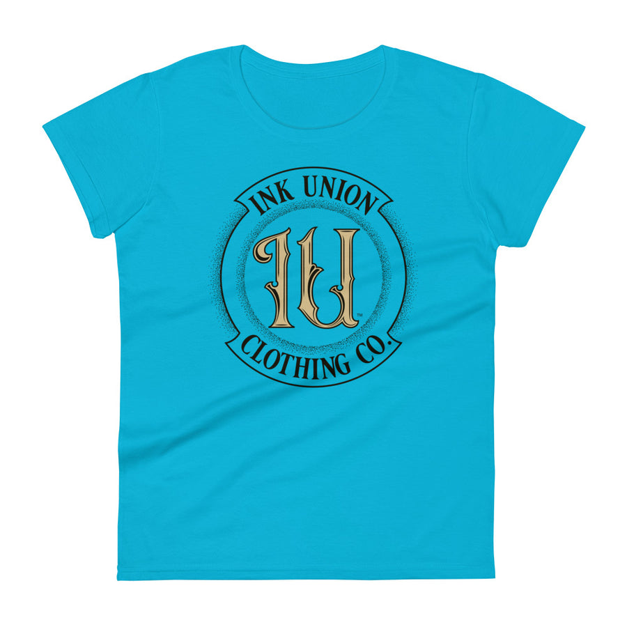 A  light blue t-shirt with the Ink Union Clothing Co Badge logo in black and gold centered on the front of the shirt.