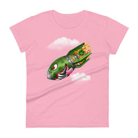 An pink t-shirt with a military green neo-traditional bomb tattoo design. The bomb is falling with a look of determination in its eyes, an evil toothy grin, and its tongue hanging out of its mouth. Flames are coming from the back of the bomb, and some clouds are in the background.