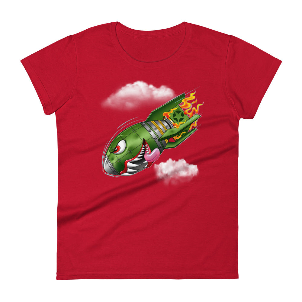 An red t-shirt with a military green neo-traditional bomb tattoo design. The bomb is falling with a look of determination in its eyes, an evil toothy grin, and its tongue hanging out of its mouth. Flames are coming from the back of the bomb, and some clouds are in the background.