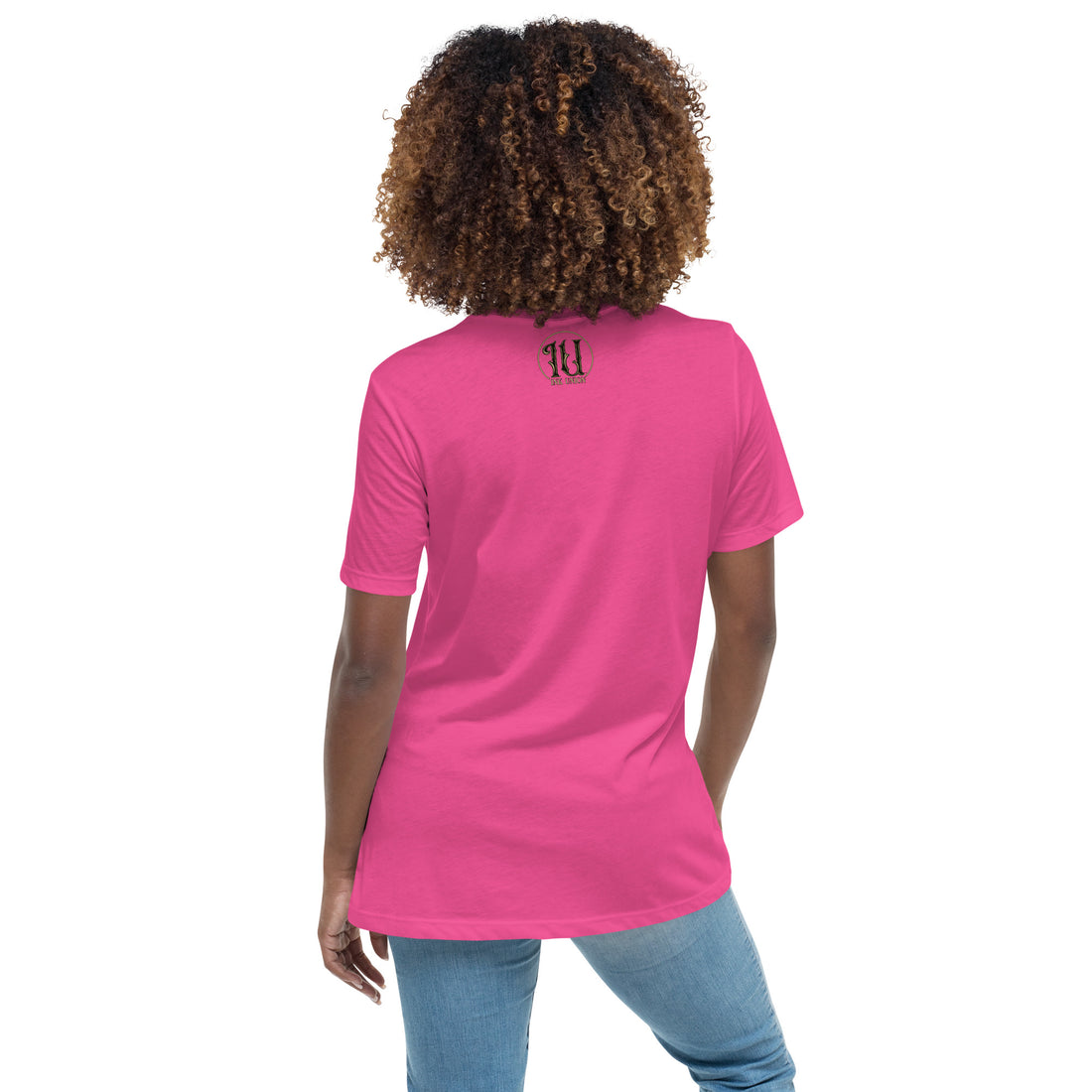 The back of an attractive woman wearing a pink t-shirt with a small gold and black Ink Union ring Logo centered just under the neckline.