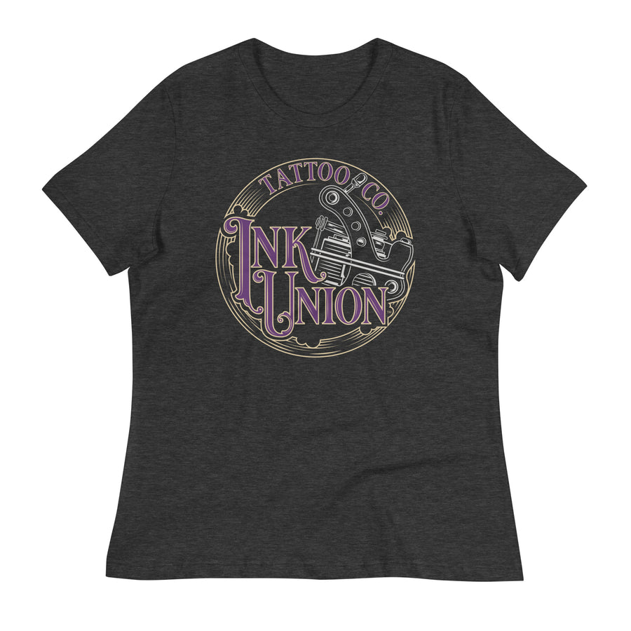A dark grey t-shirt adorned with the Ink Union Tattoo Co. purple and gold with a silver tattoo machine logo.