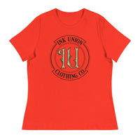 A poppy red t-shirt with the Ink Union Clothing Co Badge logo in black and gold centered on the front of the shirt.