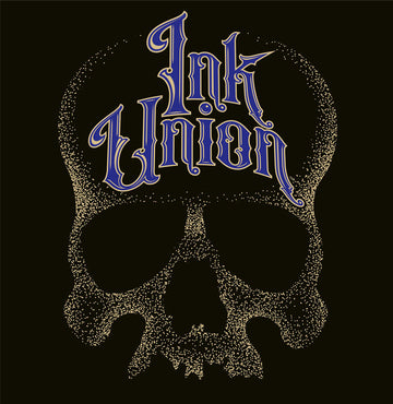 Ink Union Clothing Co. design with black background  featuring a large dot work gold skull centered on the shirt and Ink Union in large fancy gold and blue script across the forehead of the skull