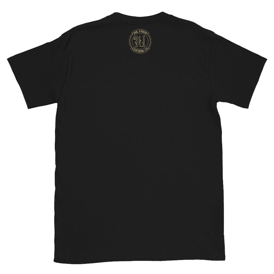 back of a black t-shirt with the ink union clothing co. gold badge logo at three inches positioned just below the collar