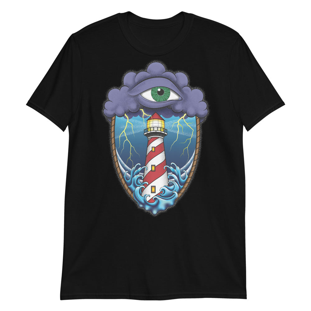 A black t-shirt with an old school eye of the storm tattoo design of large dark purple storm clouds at the top of the design with a green eye in the middle of the clouds.  Below the clouds is an oval shape with brown rope. Inside the rope are stormy seas and a lighthouse with lightning striking in the background.  At the bottom of the design, some of the waves are spilling out of the rope barrier. The sky and seas are hues of blue; the lighthouse is white and red striped like a barber pole.