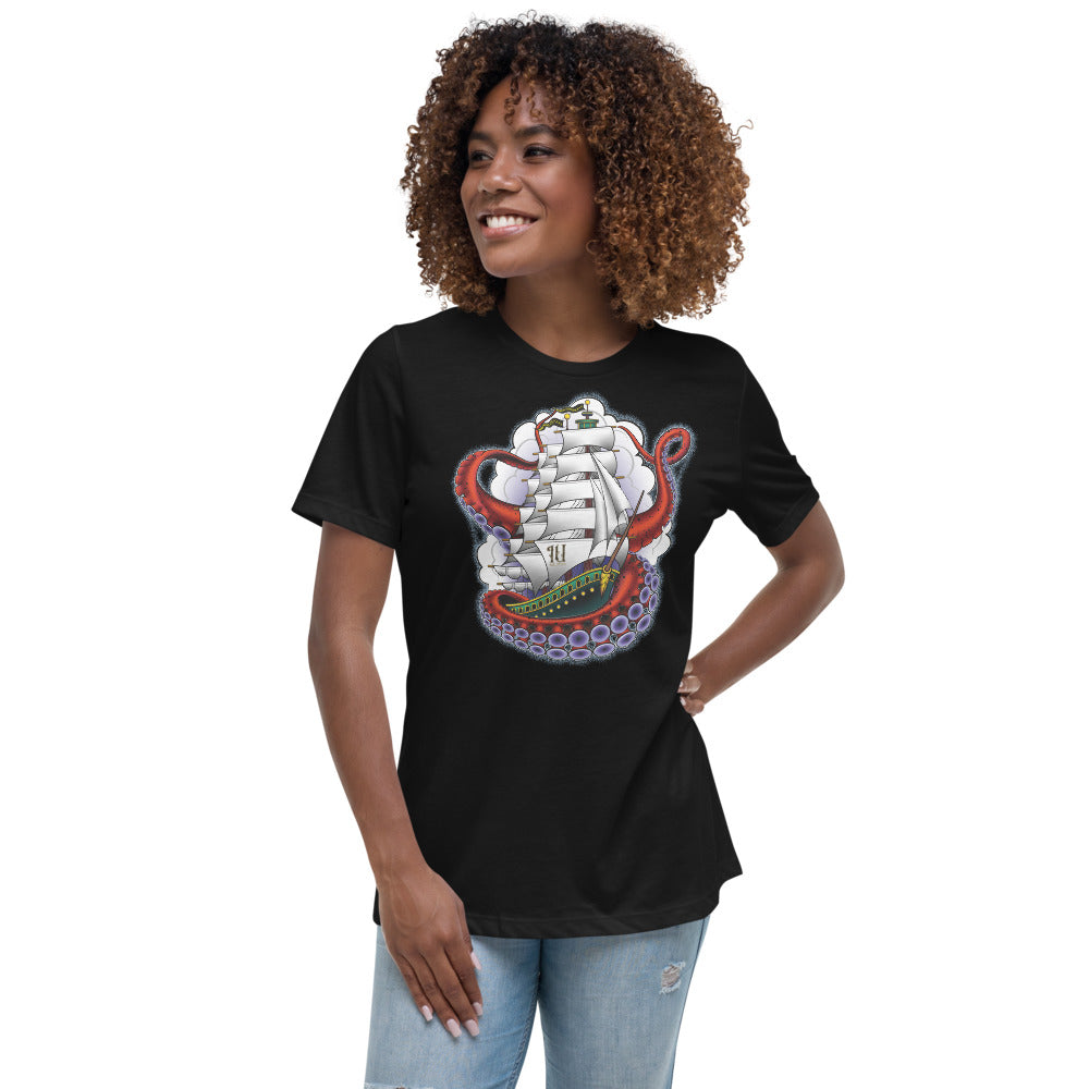 woman wearing an Ink Union Clothing Co. women's relaxed fit black t-shirt featuring a clipper ship surrounded by octopus tentacles with storm clouds in the background