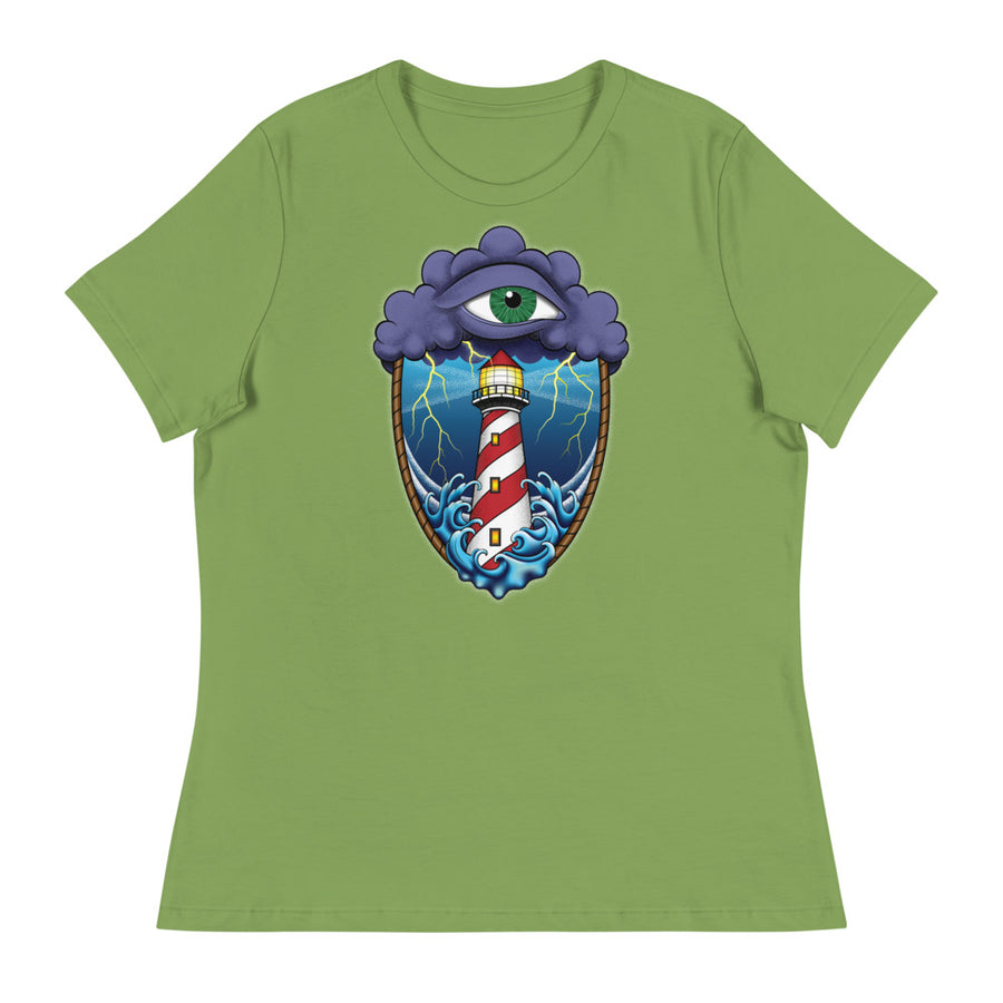 A light green t-shirt with an old school eye of the storm tattoo design of large dark purple storm clouds at the top of the design with a green eye in the middle of the clouds.  Below the clouds is an oval shape with brown rope. Inside the rope are stormy seas and lightning striking at a lighthouse that is white and red striped like a barber pole.