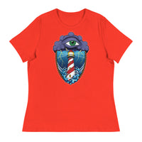 A poppy red t-shirt with an old school eye of the storm tattoo design of large dark purple storm clouds at the top of the design with a green eye in the middle of the clouds.  Below the clouds is an oval shape with brown rope. Inside the rope are stormy seas and lightning striking at a lighthouse that is white and red striped like a barber pole.